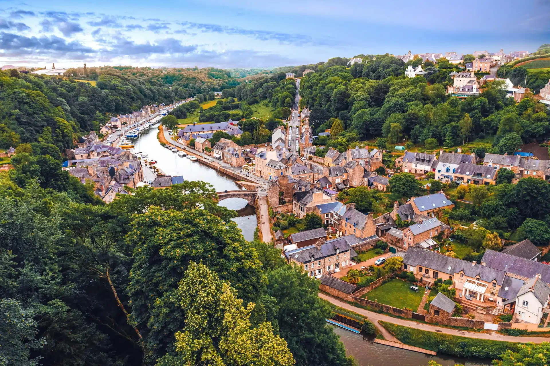 The harbour of Dinan on the river Rance and its old stone bridge, seen from above