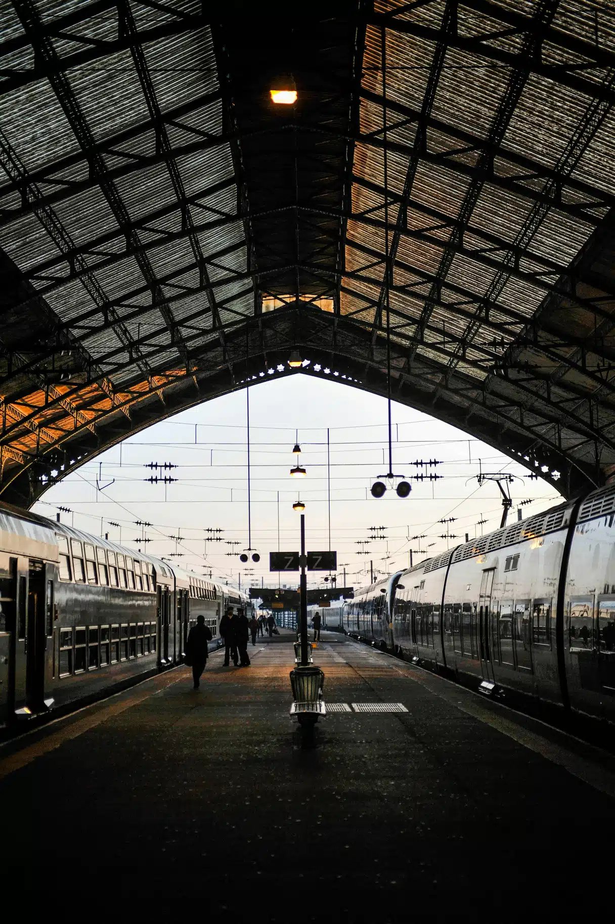 Station at sunset with 2 TGVs at the platform
