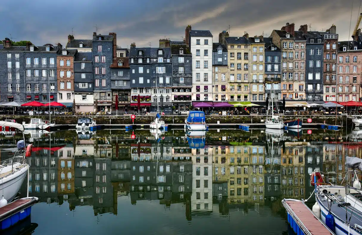Boats moored in the old harbour of Honfleur in Normandy