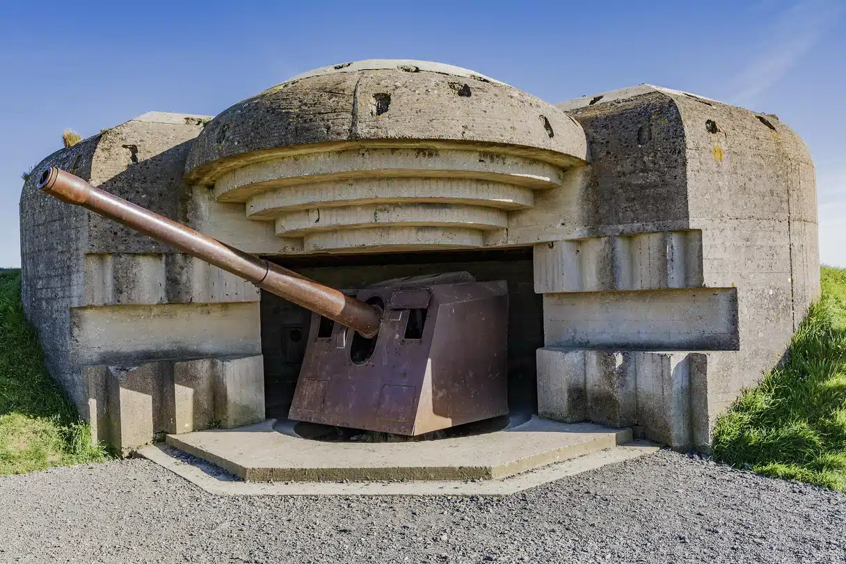 German naval cannon inside a casemate at Longues-sur-Mer Battery